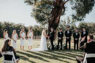 Studio portrait of model in navy tuxedo hire – FR Clothiers