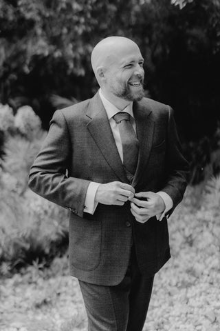 Custom tailoring process with fine fabrics at FR Clothiers workshop.