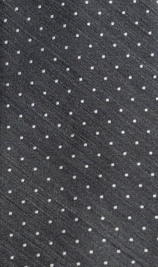 Silver polka dot tie close-up – detailed luxury silk finish